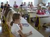Slovenski šolarji slabše bralno pismeni od povprečja