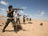 Libijski uporniki skušajo streti Gadafijeve sile v Sirti