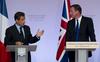 Besedni boj okoli evra: Sarkozy ukazal Cameronu, naj utihne
