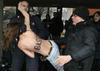 Berlusconija na volišču napadle razgaljene protestnice