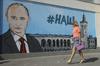 Putin na Krimskem polotoku spodbuja turizem, na vzhodu Ukrajine vre