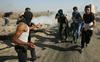 Petek revolucije zanetil spopade med Palestinci in izraelskimi silami