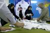 Prvi rezultati iranskih volitev kažejo na zelo tesen izid