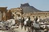 Na območju Palmire našli množično grobišče. Med mrtvimi tudi civilisti.