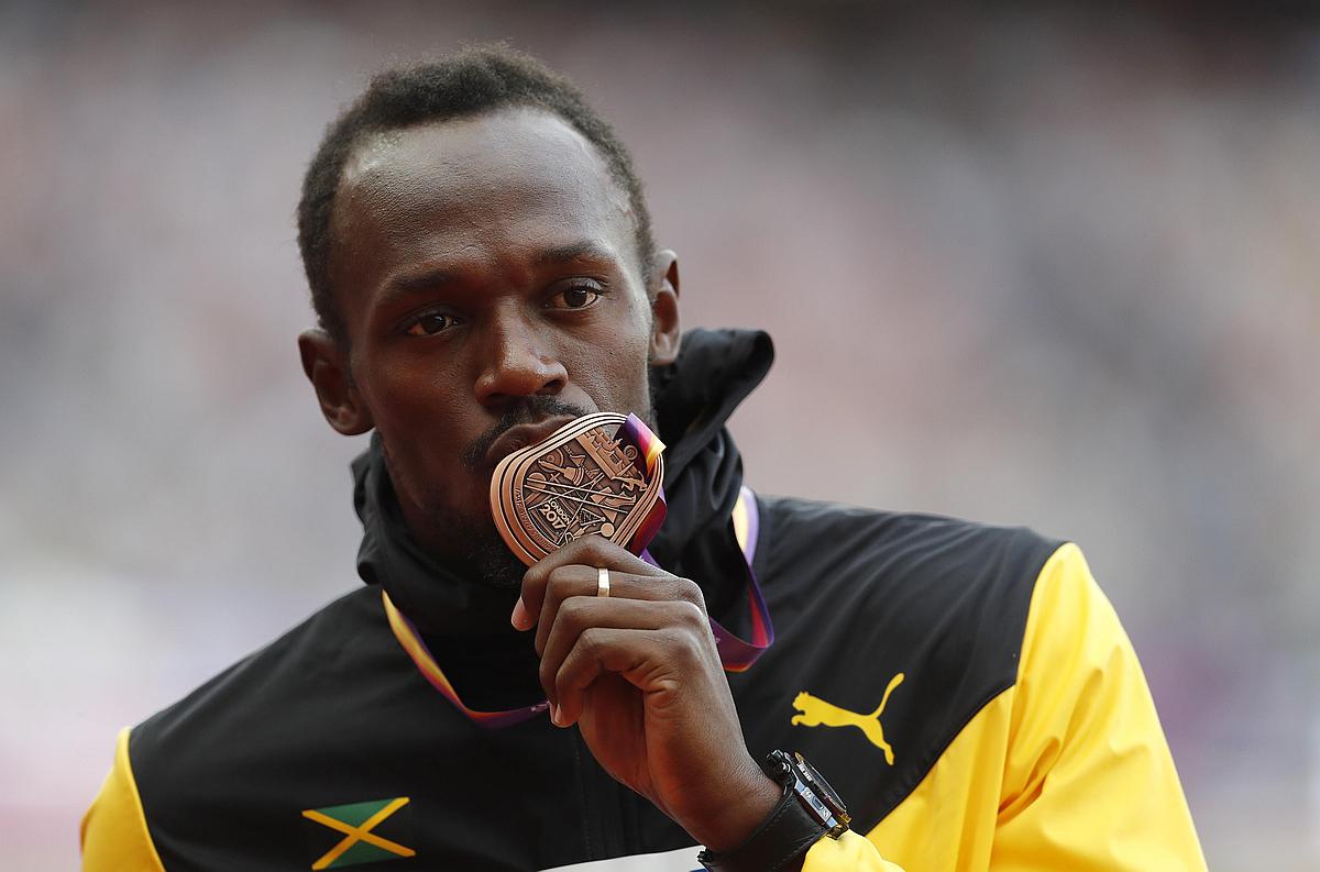Usain Bolt je na olimpijskih igrah in svetovnih prvenstvih osvojil že svojo 22. medaljo, sploh prvo bronastega leska. Foto: Reuters