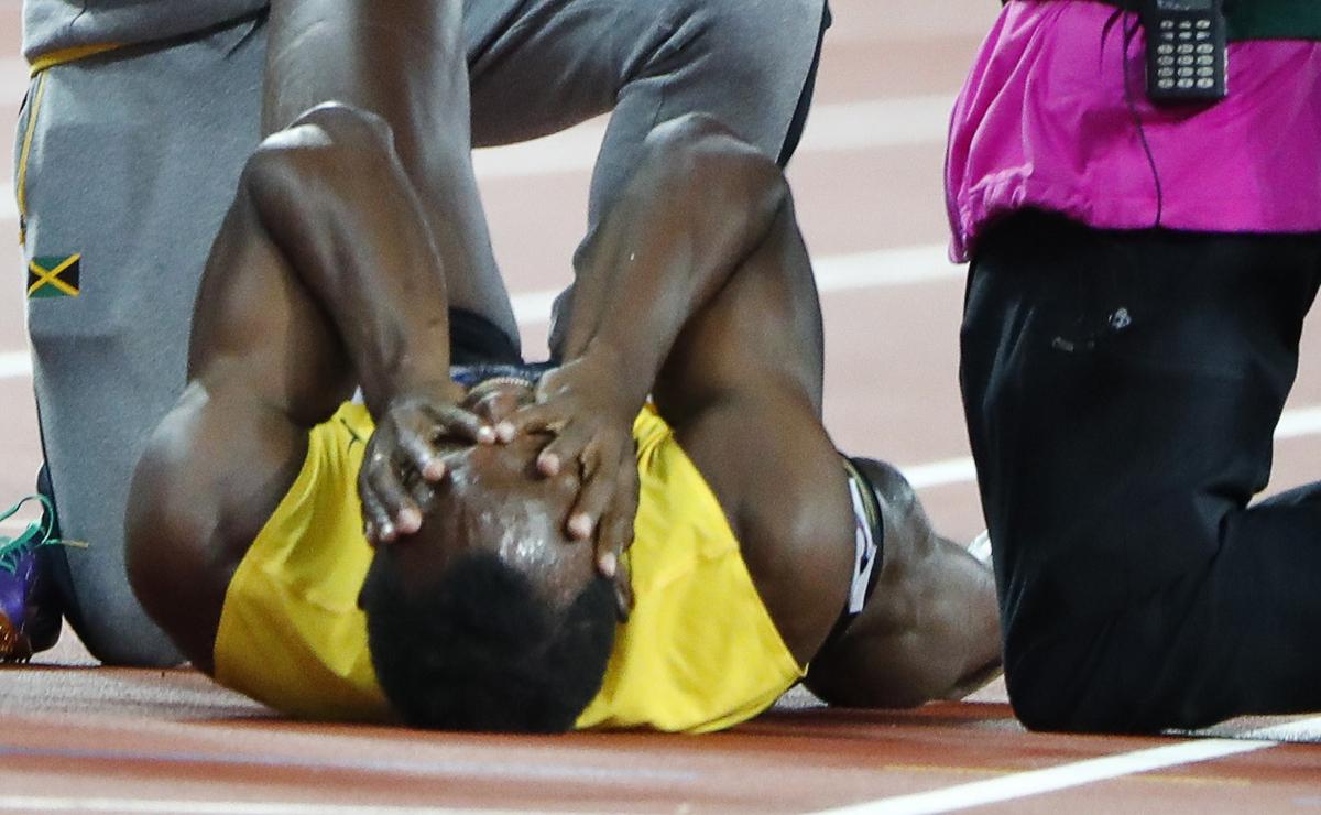 Usaina Bolta je zagrabil krč v levi stegenski mišici. Foto: Reuters