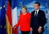 Merklova in Macron za skupno evropsko omejitev migracij