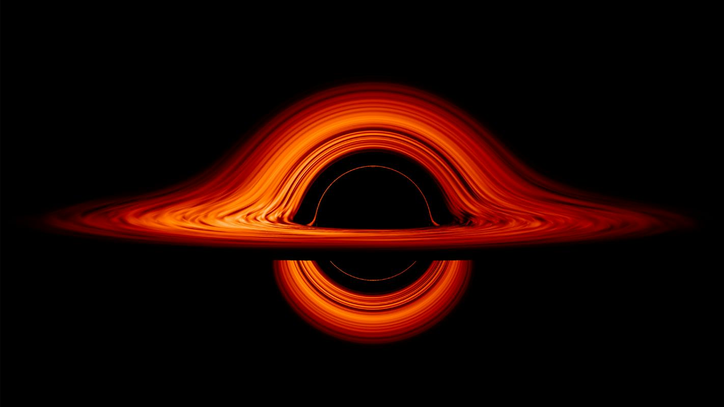 Poskus računalniške ponazoritve izgleda črne luknje. Prostor je tako ukrivljen, da vidimo tudi zadnjo stran. Foto: NASA’s Goddard Space Flight Center/Jeremy Schnittman