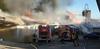 Gasilci po več urah pogasili obsežen industrijski požar v Postojni