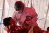 Indonezija epicenter pandemije v JV Aziji; v Vietnamu je polno cepljen le en odstotek prebivalcev