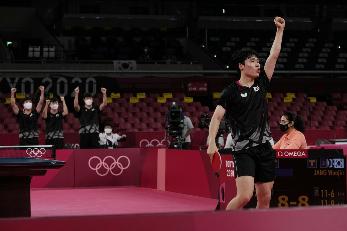 Woo-jin Jang se je takole razveselil odločilne točke proti Kožulu. Foto: AP