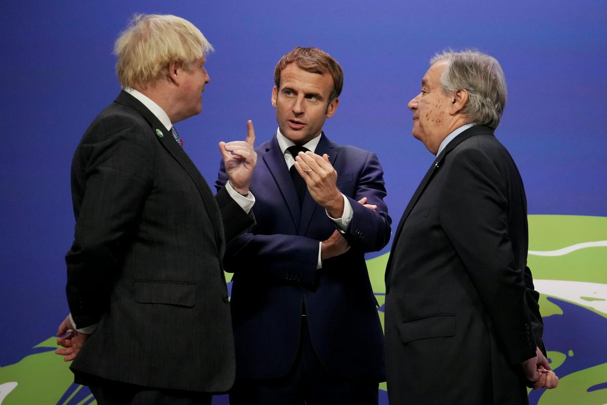 Johnson (levo), Macron (na sredini) in Guterres. Foto: Reuters