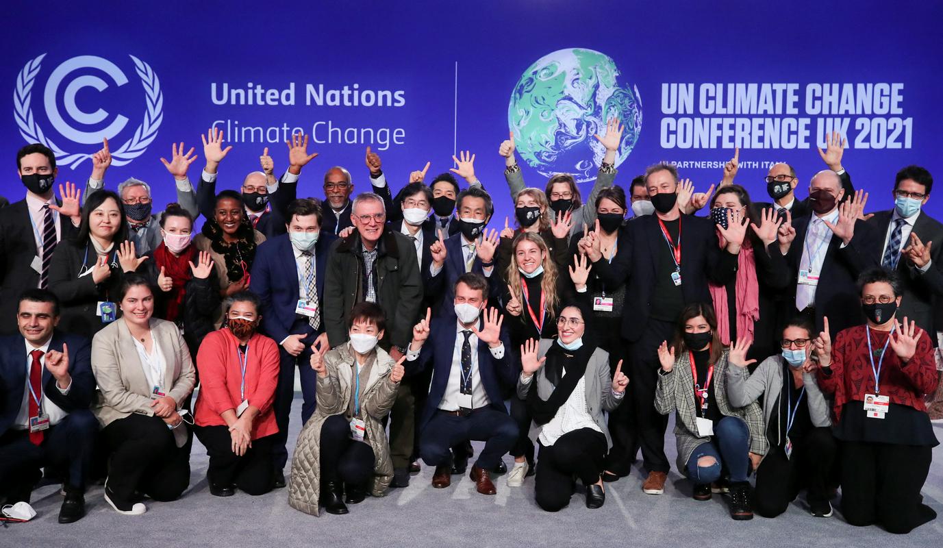Delegati na lanski podnebni konferenci COP26. Foto: EPA