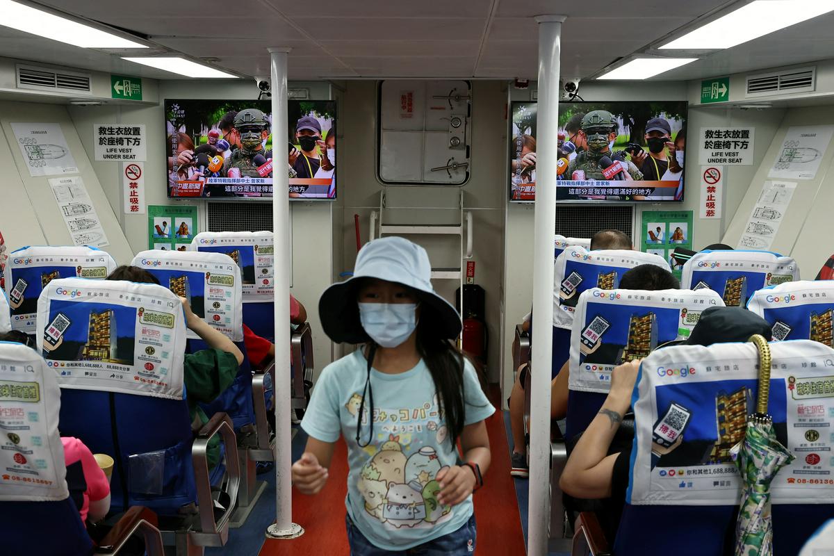 Življenje v Tajvanu poteka po ustaljenih tirnicah, a med ljudmi je čutiti zaskrbljenost zaradi zaostrenih odnosov s celinsko Kitajsko. Foto: Reuters