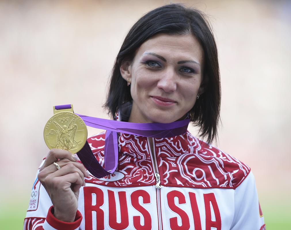 Če bo diskvalifikacija dokončna, bo Natalija Antjuh obdržala le olimpijski medalji iz Aten 2004, ko je bila bronasta na 400 m z ovirami in srebrna v štafeti 4x400 m. Foto: EPA