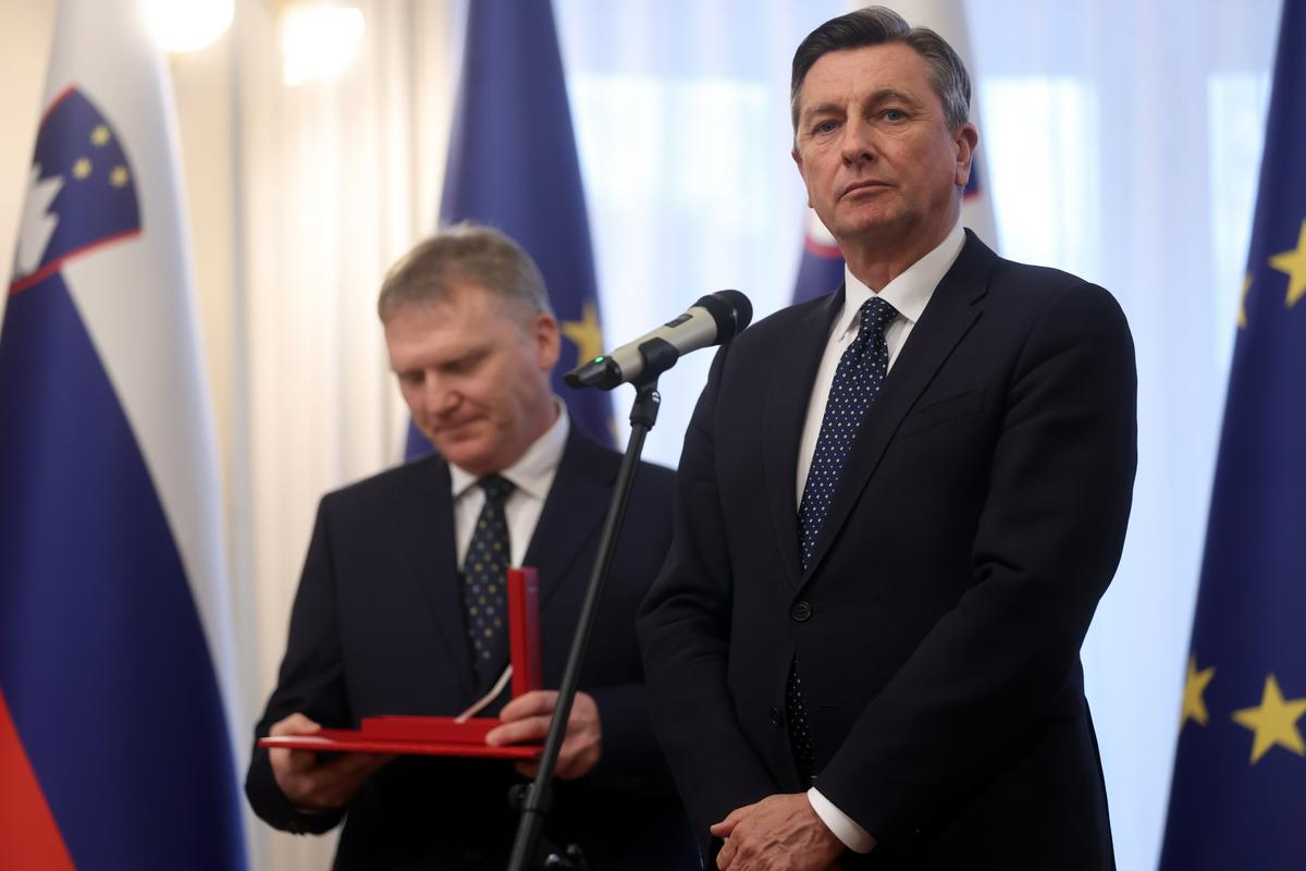 Borut Pahor in v ozadju Pučnikov sin Gorazd. Foto: BoBo/Borut Živulović