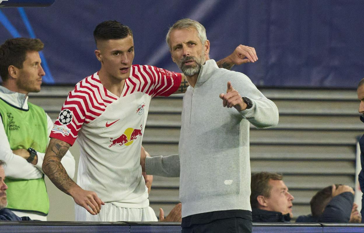 Benjamin Šeško in trener Leipziga Marco Rose. Foto: Reuters