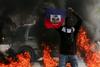 Haitijska vlada po uličnih spopadih in množičnem begu iz zapora razglasila izredne razmere