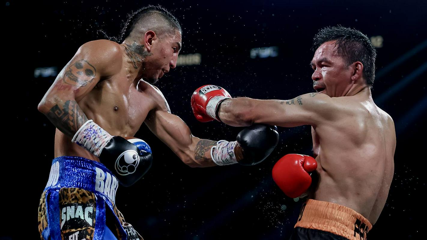 Pacquiao poražen po točkah; Usik združil vse naslove